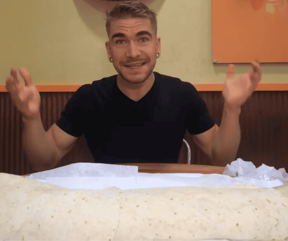 Joel Hansen eating a giant burrito at Taco Bus